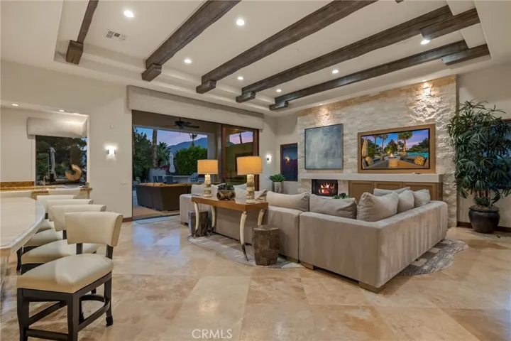 Soaring beamed ceilings and cozy fireplace