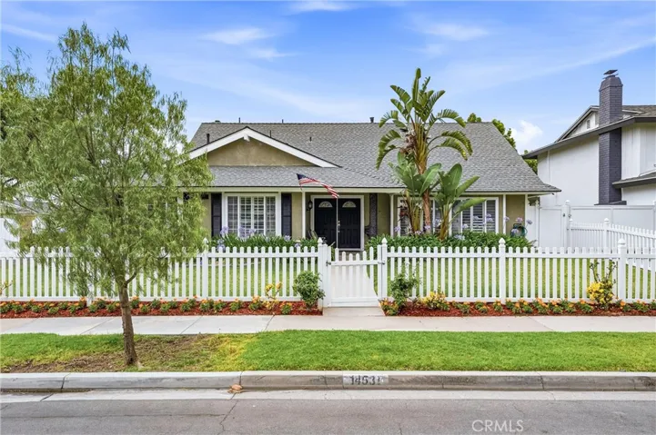 Double door entry with attractive white vinyl picket fence