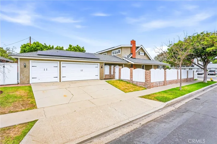 3 car garage at the rear of the house accessed through the side street