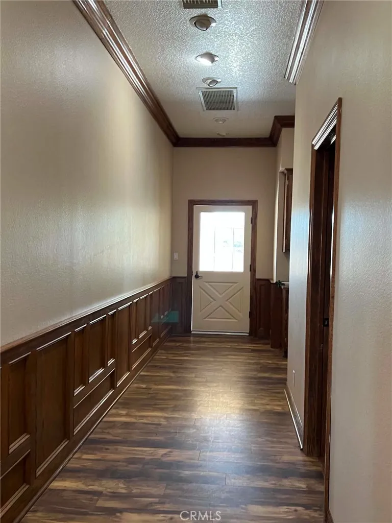 hallway leading to laundry room and outside patio