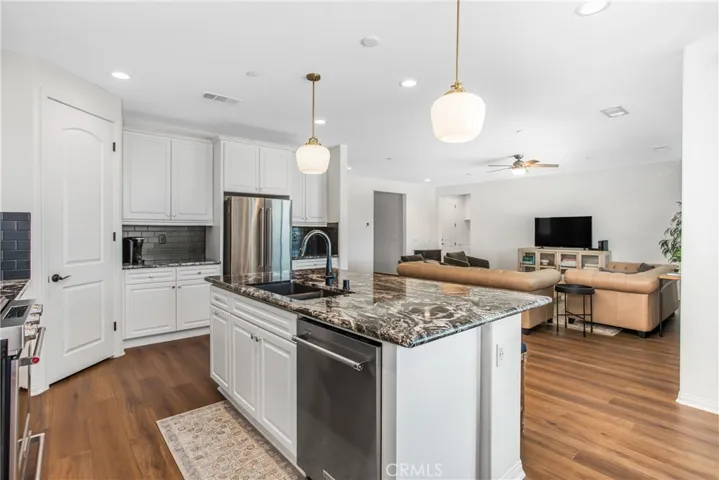 open concept kitchen offers, granite counter tops with a stylish backsplash!