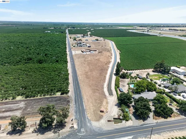 Aerial Photo showing the canal and road frontage and surrounding farm land and overall settings