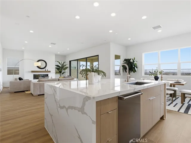 Kitchen to Living Room: Merle Prairie Inspired - Skylar at FivePoint Valencia - Photos of another homesite - Not actual home for sale - Photos have similar finishes/selections of homesite 58
