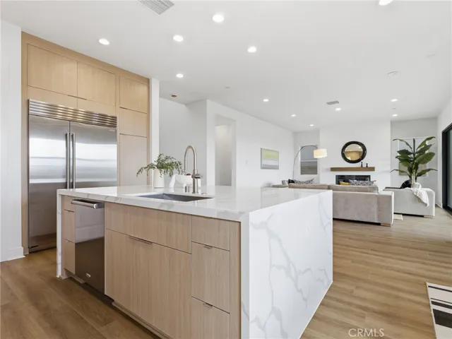 Kitchen to Living Room: Merle Prairie Inspired - Skylar at FivePoint Valencia - Photos of another homesite - Not actual home for sale - Photos have similar finishes/selections of homesite 58