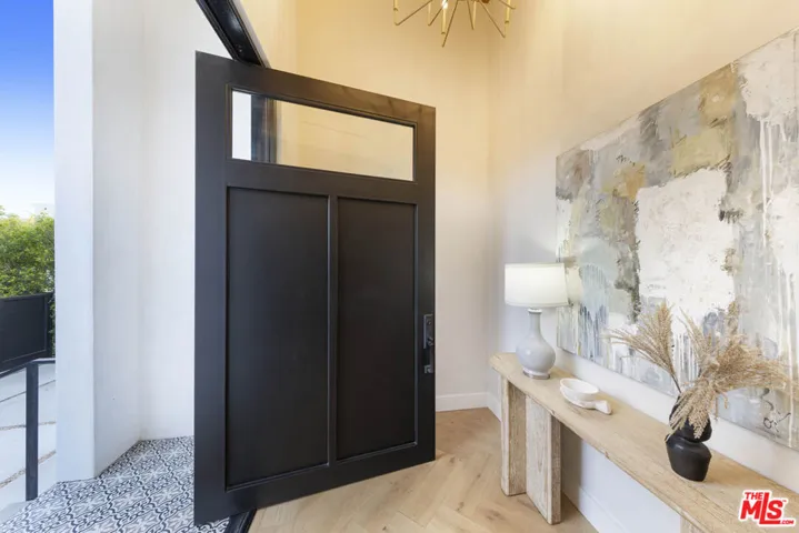 Dramatic pivot door and foyer