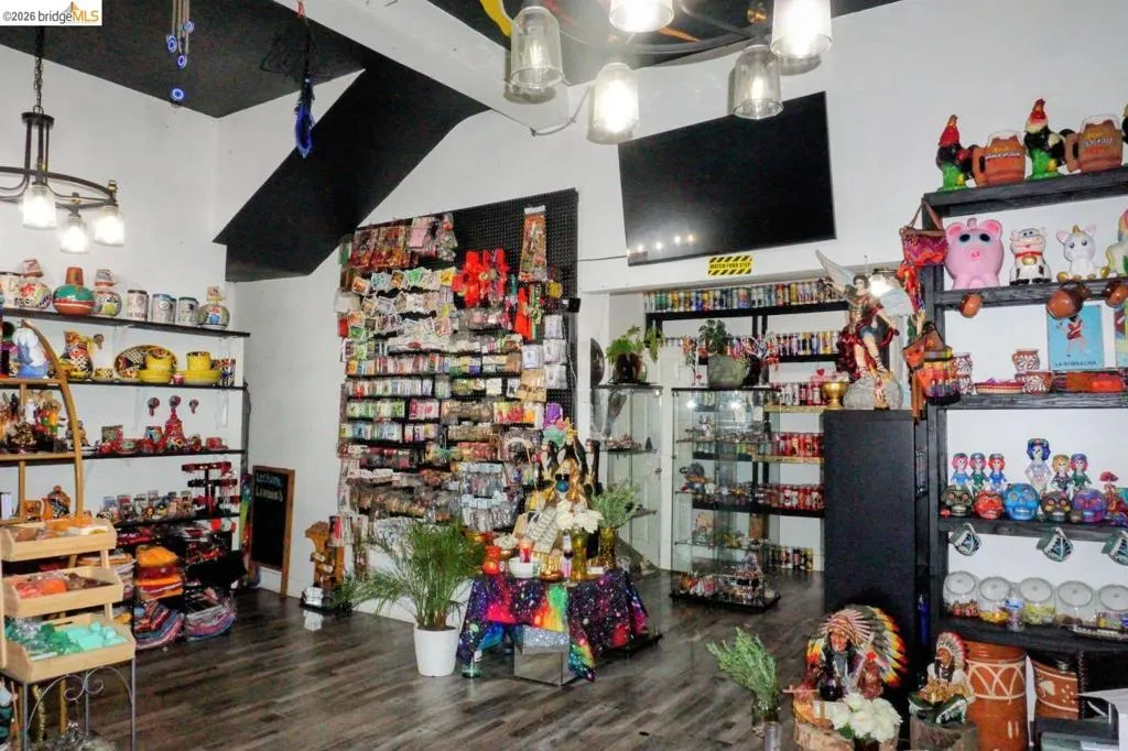 Retail space featuring wood-finish flooring and track lighting