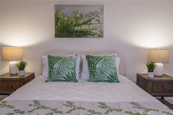 Spacious primary bedroom will easily accomodate a California King bed.