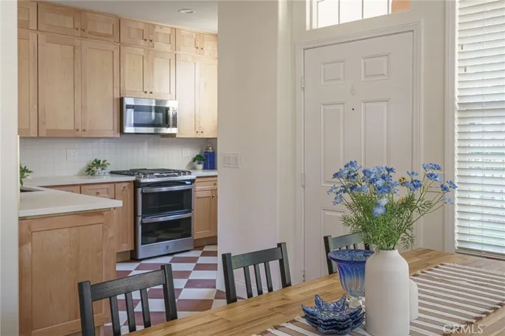 Another perspective of the dining area into the kitchen.