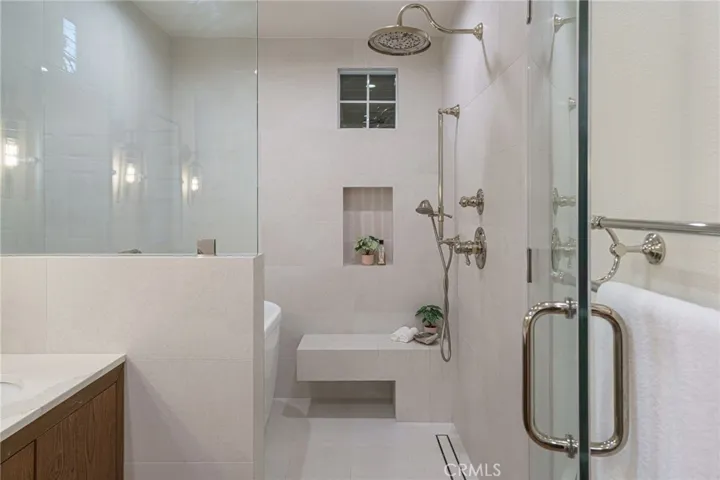 A Japanese inspired shower and bath closet.  If you've ever travled their this might seem familiar.  In shower deep Japanes tub for soaking.  Shower bench and custom fixtures, tile work and French drain.