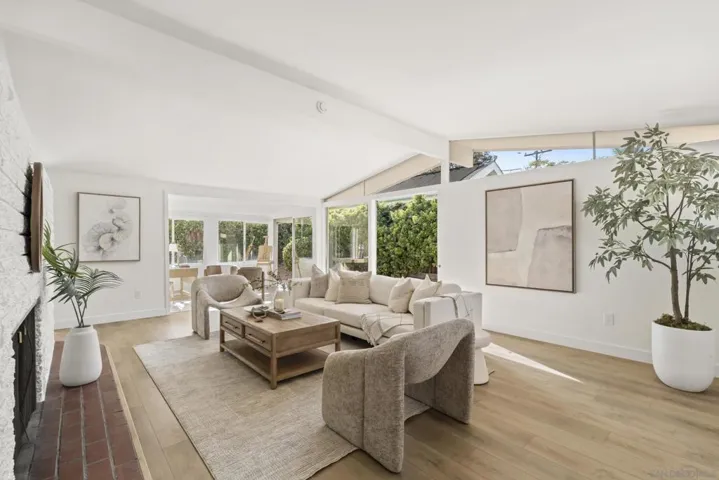 Bright living room space with lots of windows and natural light.