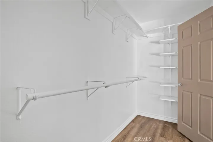 Primary bedroom walk-in closet.
