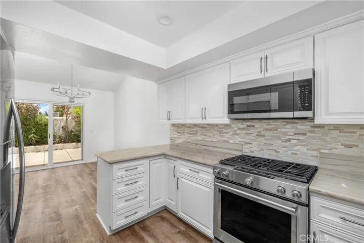 Kitchen with ample storage and sleek counters.