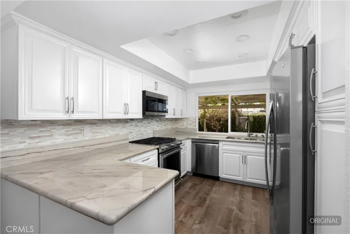 Kitchen with ample storage and sleek counters.