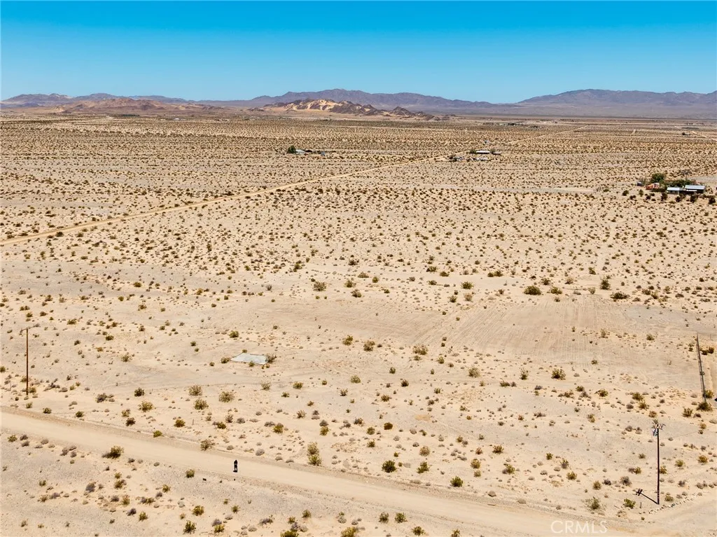 Breathtaking 360-degree high-desert views from the property, highlighting the serene privacy and vast blue skies.