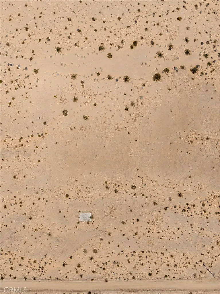 Detailed, direct-down aerial view illustrating the pristine, 100% usable sandy desert terrain of the parcel.