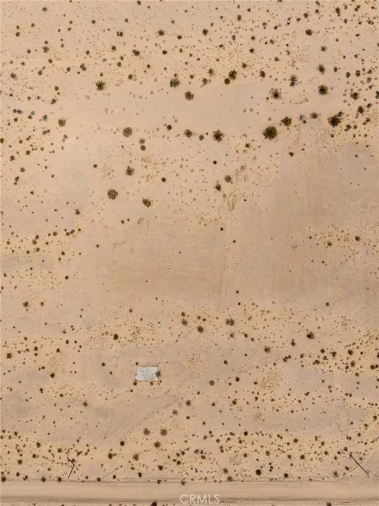 Detailed, direct-down aerial view illustrating the pristine, 100% usable sandy desert terrain of the parcel.