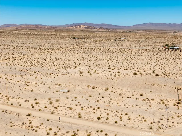 Breathtaking 360-degree high-desert views from the property, highlighting the serene privacy and vast blue skies.