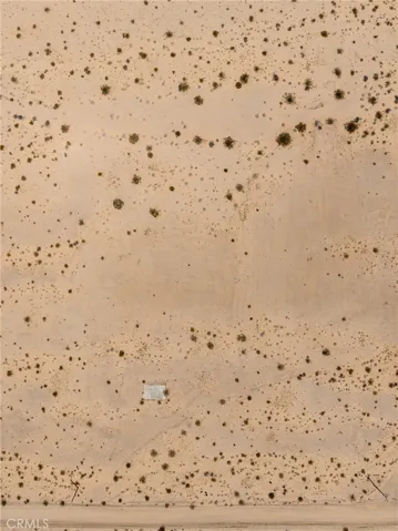 Detailed, direct-down aerial view illustrating the pristine, 100% usable sandy desert terrain of the parcel.