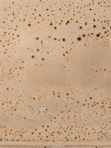 Detailed, direct-down aerial view illustrating the pristine, 100% usable sandy desert terrain of the parcel.