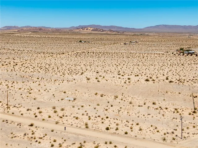 Breathtaking 360-degree high-desert views from the property, highlighting the serene privacy and vast blue skies.