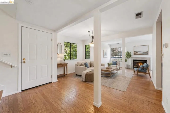 Hardwood flooring throughout the entry and main living area
