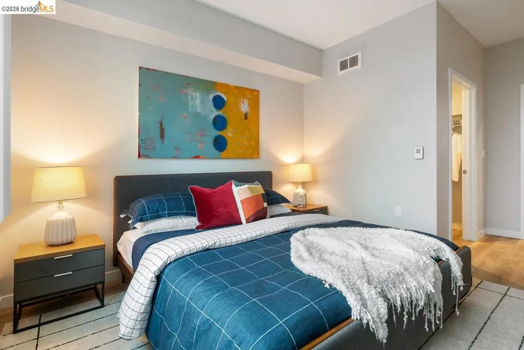 Bedroom with baseboards and wood finished floors