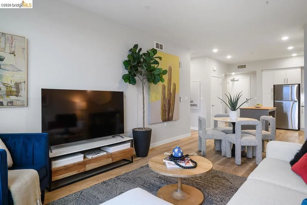 Living room featuring light wood-type flooring and recessed lighting