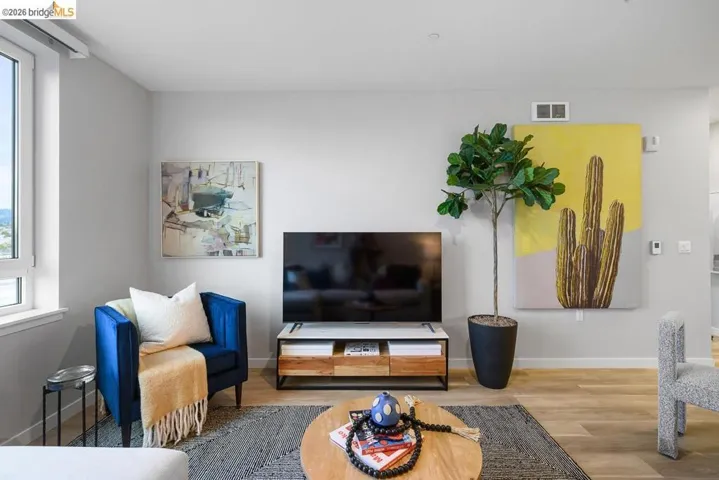 Living room featuring wood finished floors and baseboards