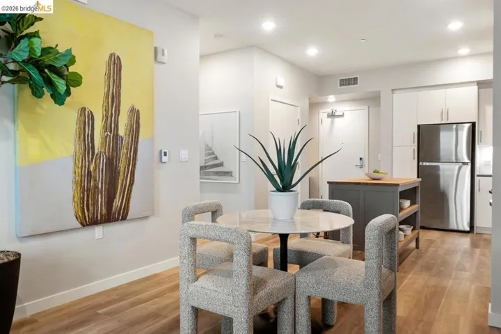 Dining space with light wood-style flooring and recessed lighting