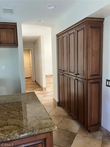 kitchen, pantry, hall to powder room and garage
