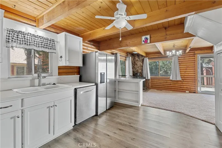 Kitchen open to living room and dining area.