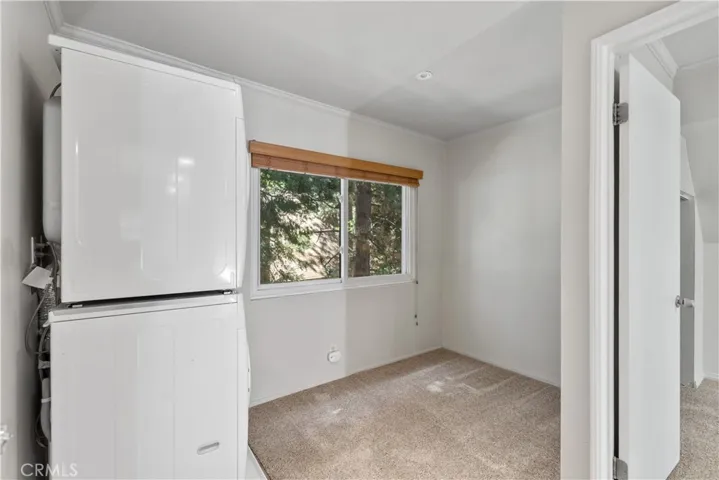 2nd floor laundry area with stackable.