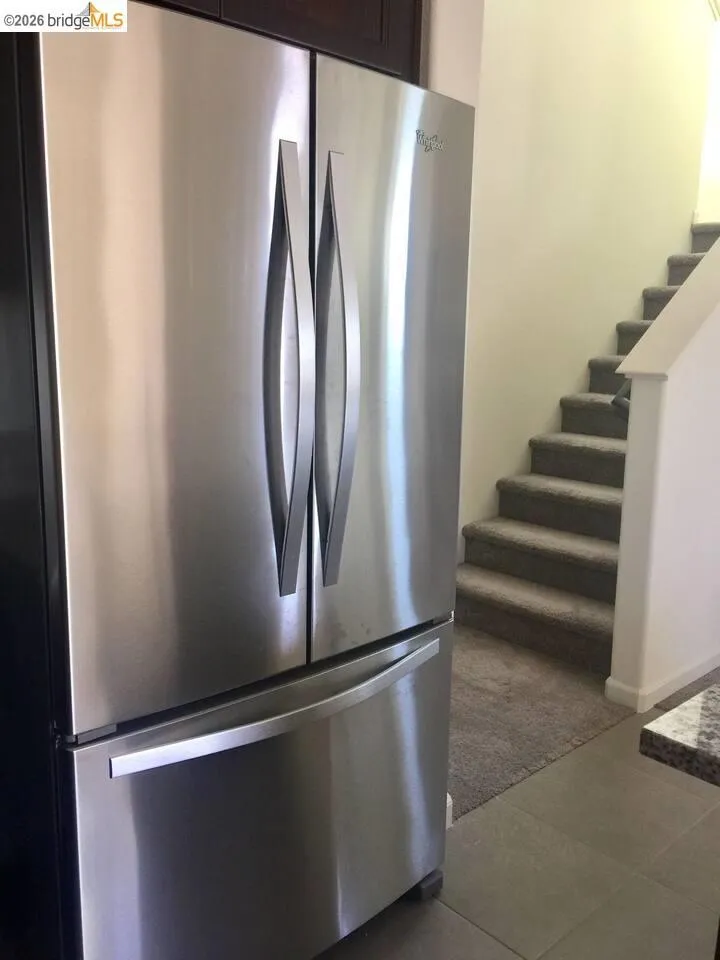 Stainless steel French door refrigerator with a bottom freezer drawer