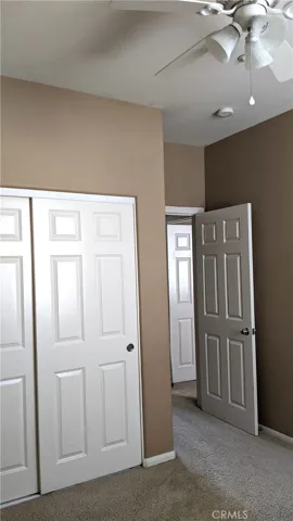 2nd bedroom with ceiling fan, 6-panel doors