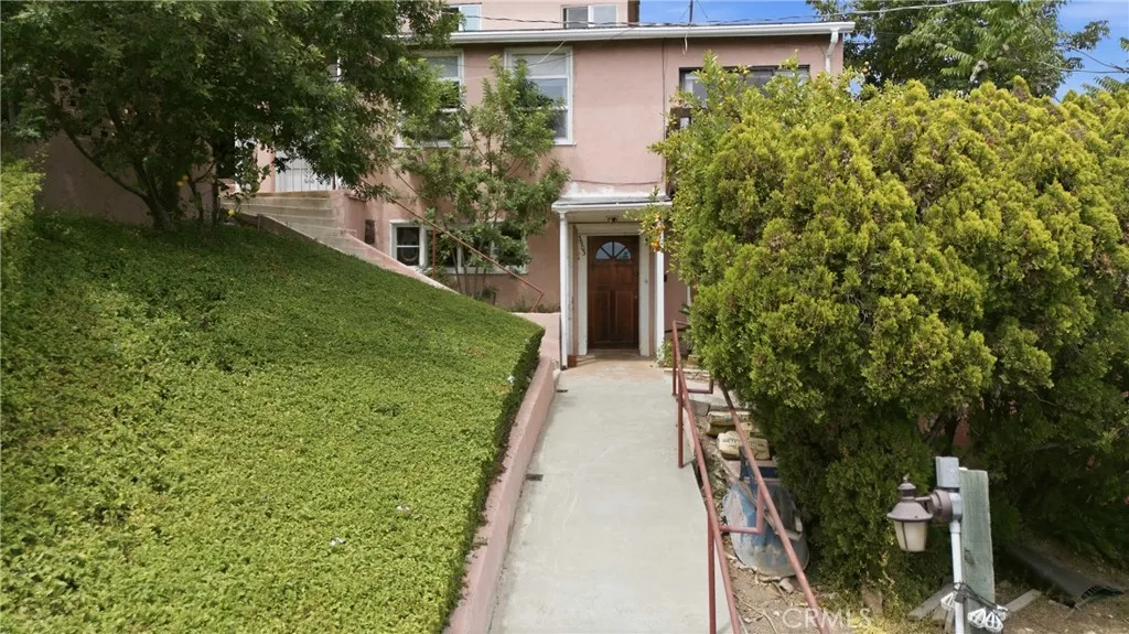 Unit 2 features 1 bedroom with  sliding glass from living room and bedroom that open up to gorgeous courtyard with an Immaculate View