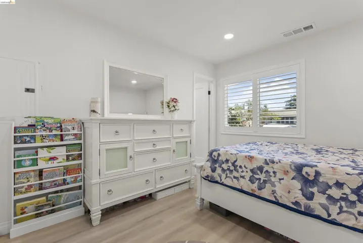 Neutral wall paint and wood-finish flooring create a bright interior