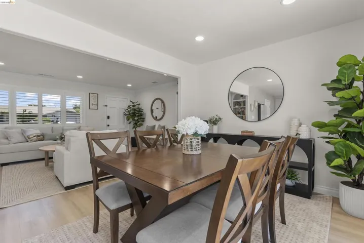 Bright dining area featuring a wood-finish table and chairs