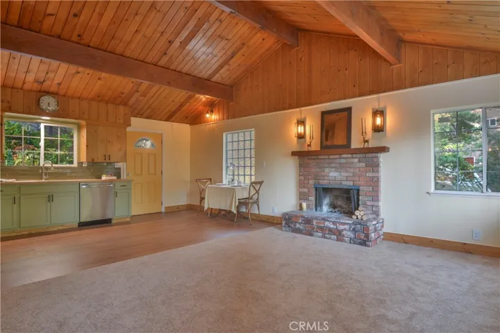 Cozy fireplace in family room with open concept with kitchen and eating area