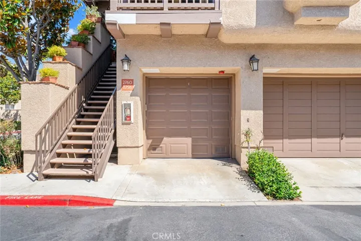 Garage and stairs to Condo