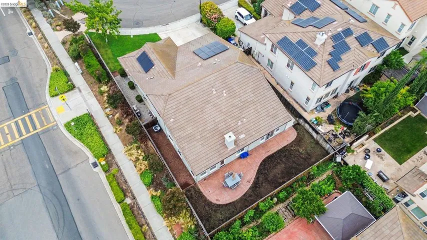 Residences featuring tiled roofs and rooftop solar panels