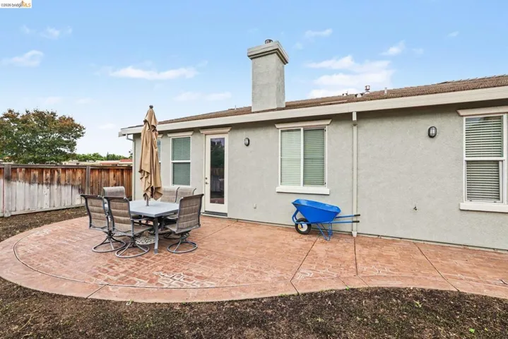 Stucco exterior with a stamped concrete patio