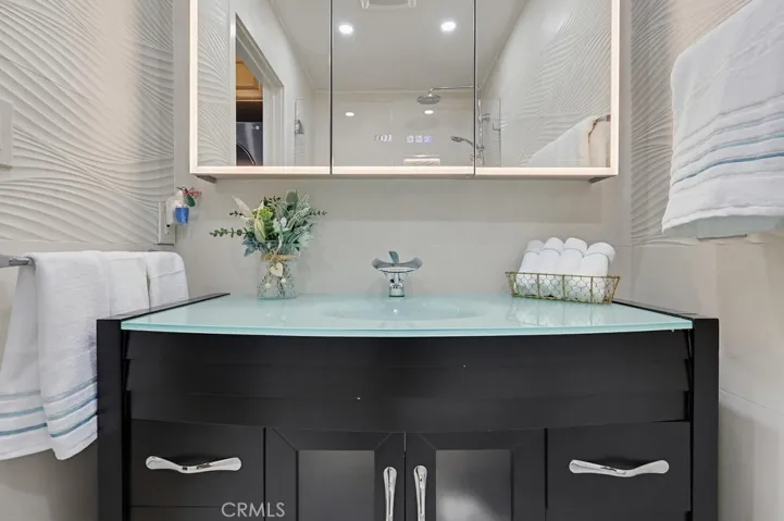 Custom vanity with glass counter.