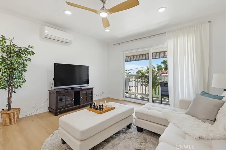 Living Room with recessed lighting, ceiling light fan, mini-split Air Conditioner & Heating.