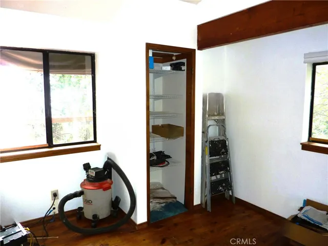 The rear bedroom on the main level of the home is currently being used as an office.