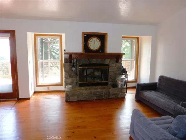 The beautiful rock fireplace in the living room is the focal point on the main level of the home.
