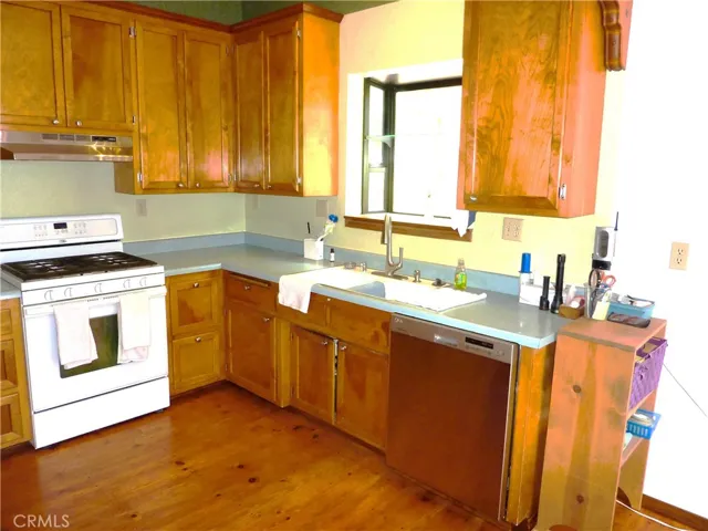 The kitchen is open to the dining area. The double sink has a nice window which brings extra light into the home.
