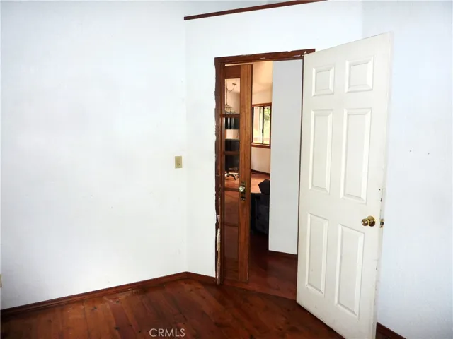 The front main level bedroom is just off the living room of the home.