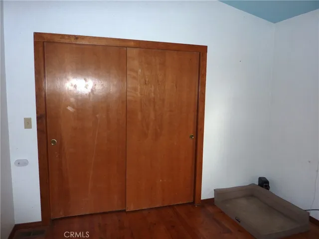 Large closet in the main level bedroom on the front side of the home.