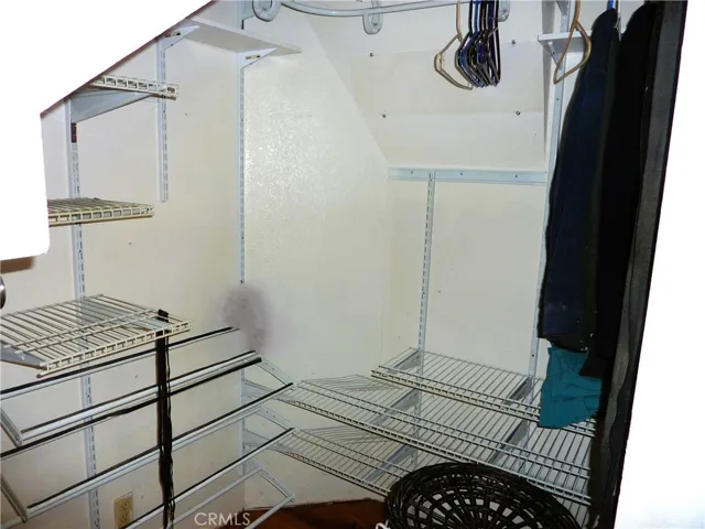 Plenty of shelving space for everything in the master bedroom closet.