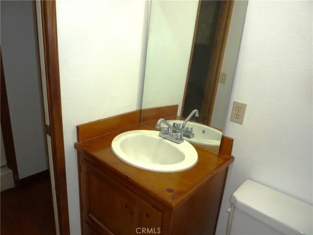 Another wood counter top in the half bath on the lwer level.